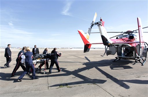 In this Jan. 21, 2011 photo released by the office of Rep. Gabrielle Giffords, D-Ariz., Rep. Giffords is moved toward a waiting helicopter after arriving in Houston. Giffords, who is recovering from a gunshot wound to the head was transferred to a Houston rehabilitation center. (AP Photo/Office of Rep. Giffords, F. Carter Smith) MANDATORY CREDIT (AP)