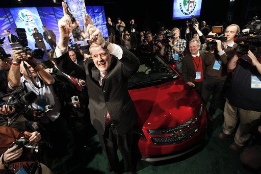 FILE - In this Jan. 10, 2011 file photo, Tom Stephens, Vice Chairman of General Motors, holds up the North American International Auto Show Car of the Year trophy awarded to the Chevrolet Volt. General Motors Co., sold more cars and trucks in China last year than it did in the U.S., for the first time in the company's 102-year history.(AP Photo/Paul Sancya, file) (AP)
