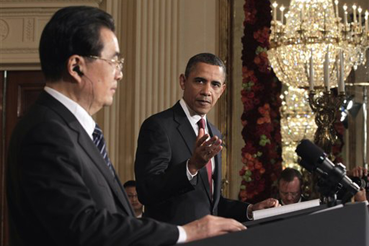 President Barack Obama gestures during his joint news conference with China's President Hu Jintao, Wednesday, Jan. 19, 2011, in the East Room of the White House in Washington. (AP Photo/J. Scott Applewhite) (J. Scott Applewhite)