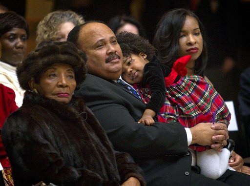 Christine King Farris, from left, the only living sibling of Dr. Martin Luther King Jr., along with Dr. King's son, Martin Luther King III, his daughter Yolanda, 2, and wife Arndrea, look on during a ceremony honoring the late civil rights leader in the State Capitol Thursday, Jan. 13, 2011, in Atlanta. The nation will mark the 25th federal observance of King's birthday on Monday. (AP Photo/David Goldman) (AP)