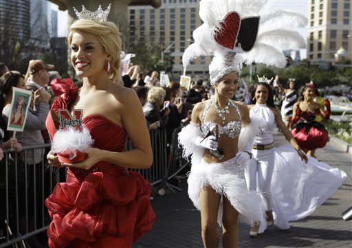 Miss Nebraska, Teresa Scanlan, left, followed by Miss Nevada Cris Crotz and Miss New Hampshire, Krystal Lee Muccioli walk in the "Show Us Your Shoes" parade as part of this week's Miss America festivities Friday, Jan. 14, 2011 in Las Vegas. (AP Photo/Julie Jacobson) (AP)