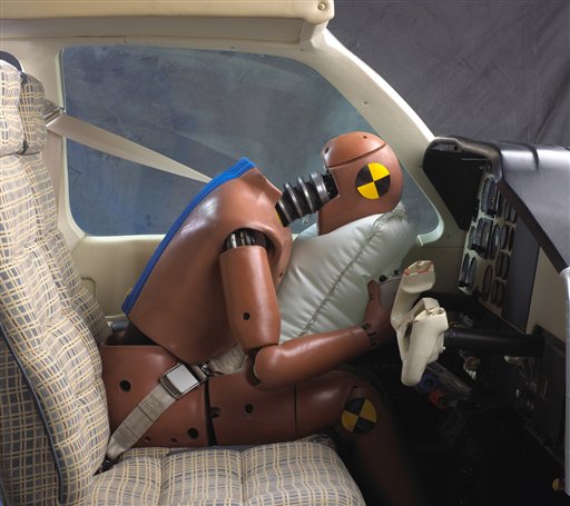 This image provided by AmSafe Inc., demonstrates an aviation airbag using a crash dummy. The airbags are located on the shoulder harness and deploy on impact. The National Transportation Safety Board is set to release a study on Tuesday, Jan. 11, 2011, of 138 accidents involving planes equipped with air bags. (AP Photo/AmSafe Inc.) (AP)
