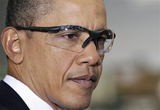 President Barack Obama wears safety glasses during a tour of the Thompson Creek Window Company, where he spoke on the economy, in Landover, Md., Friday, Jan. 7, 2011. (AP Photo/J. Scott Applewhite) (AP)