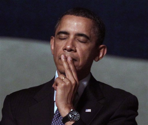 President Barack Obama pauses during a memorial service for Richard Holbrooke at the Kennedy Center, Friday, Jan. 14, 2011, in Washington.  Holbrooke, veteran US diplomat and Obama's special envoy to Afghanistan and Pakistan, died in December at the age of 69. (AP Photo/Carolyn Kaster) (AP)