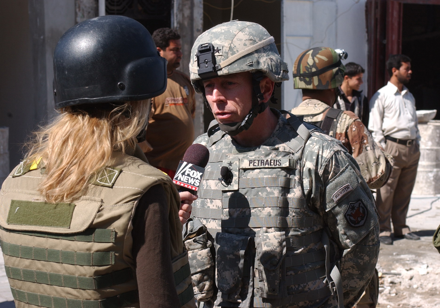 Gen. David Petraeus, right, commander of Multi National Corps Forces in Iraq gets interviewed by Fox News Reporter Clurissa Ward, left, at the Al Shurja Market Place in the Rusafa area of E. Baghdad, Iraq on March 11, 2007. (U.S Army Photo by SPC. Davis Pridgen) (Released). (Spc Davis Pridgen)
