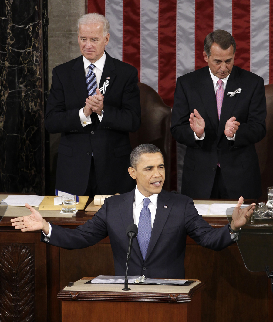 President Barack Obama gestures on Capitol Hill in Washington, Tuesday, Jan. 25, 2011, prior to delivering his State of the Union address in Washington, Tuesday, Jan. 25, 2011. Vice President Joe Biden and House Speaker John Boehner of Ohio applaud at rear. (AP Photo/Charles Dharapak) (Charles Dharapak)