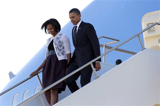 President Barack Obama and first lady Michelle Obama arrive in Tucson, Ariz., to attend a memorial service for victims of last Saturday's shooting rampage that killed six people and left 14 injured, including Rep. Gabrielle Giffords, at Davis-Monthan Air Force Base, Wednesday, Jan. 12, 2011.  (AP Photo/J. Scott Applewhite) (AP)