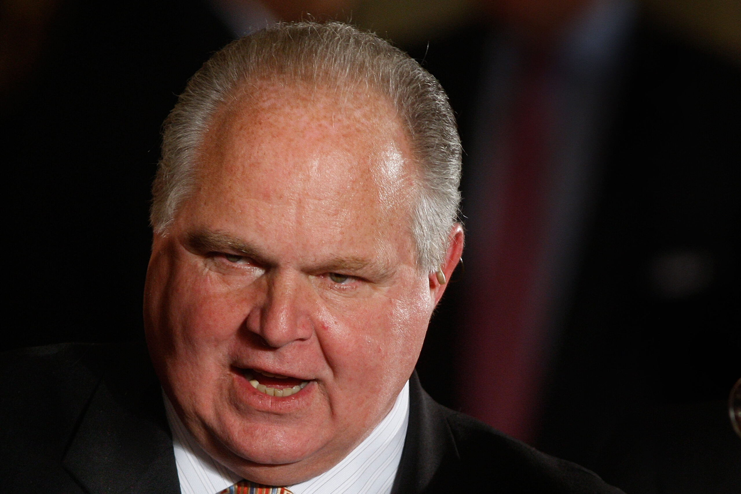 Conservative talk show host Rush Limbaugh talks with guests in the East Room of the White House in Washington, Tuesday, Jan. 13, 2009, prior to a Presidential Medal of Freedom ceremony for Colombian President Alvaro Uribe, former British Prime Minister Tony Blair and former Australian Prime Minister John Howard.(AP Photo/Ron Edmonds) (Associated Press)