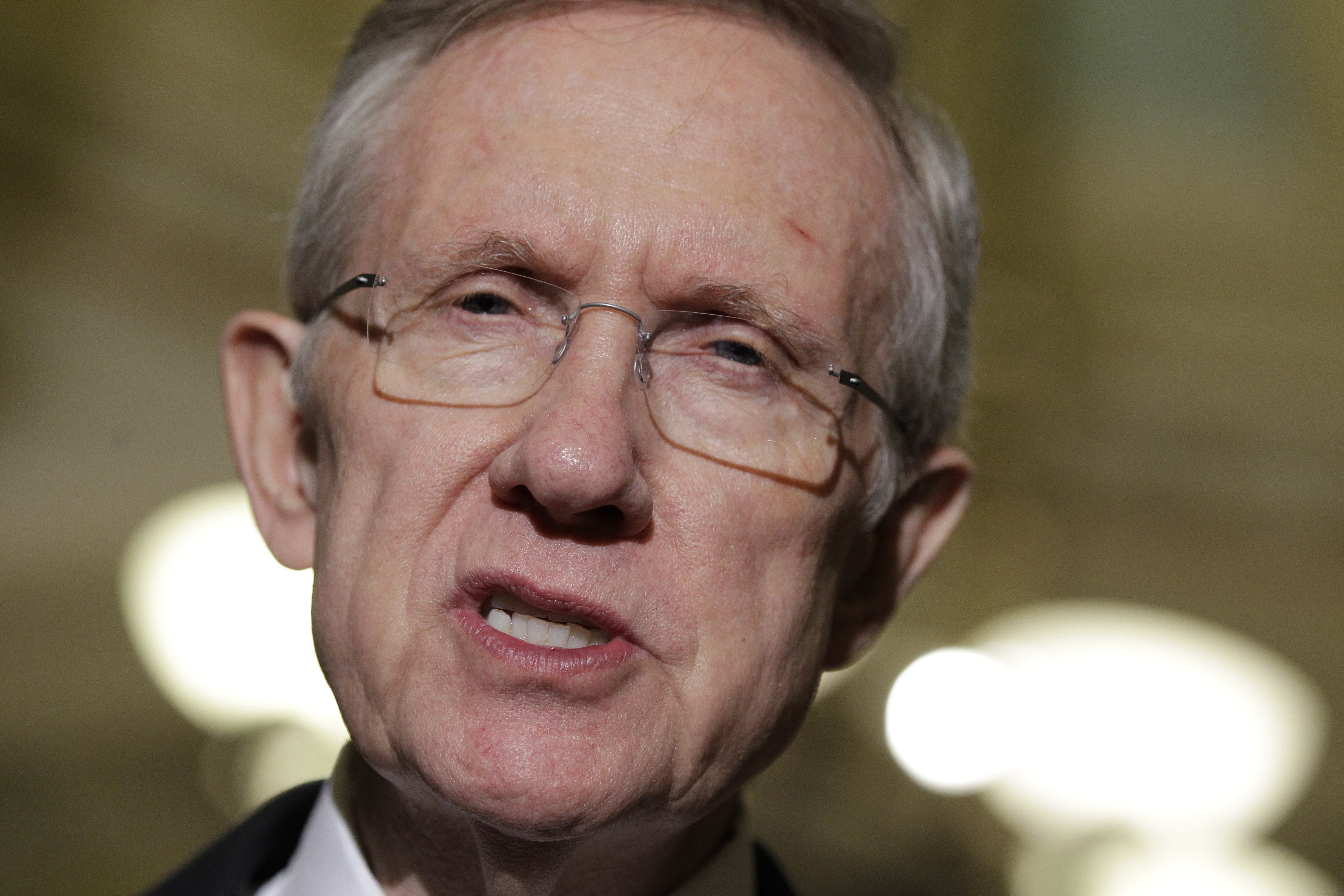 FILE - In this Jan. 6, 2011, file photo Senate Minority Leader Harry Reid of Nevada speaks to reporters on Capitol Hill in Washington. Asked on NBC television's "Meet the Press" being aired Sunday, Jan. 9, 2011, if he believes the tea party will be a lasting political force, Reid said the movement emerged because of the country's economic problems, that the tea party will no longer exist when the economy improves, and that the economy is getting better every day. (AP Photo/Charles Dharapak, File) (Associated Press)