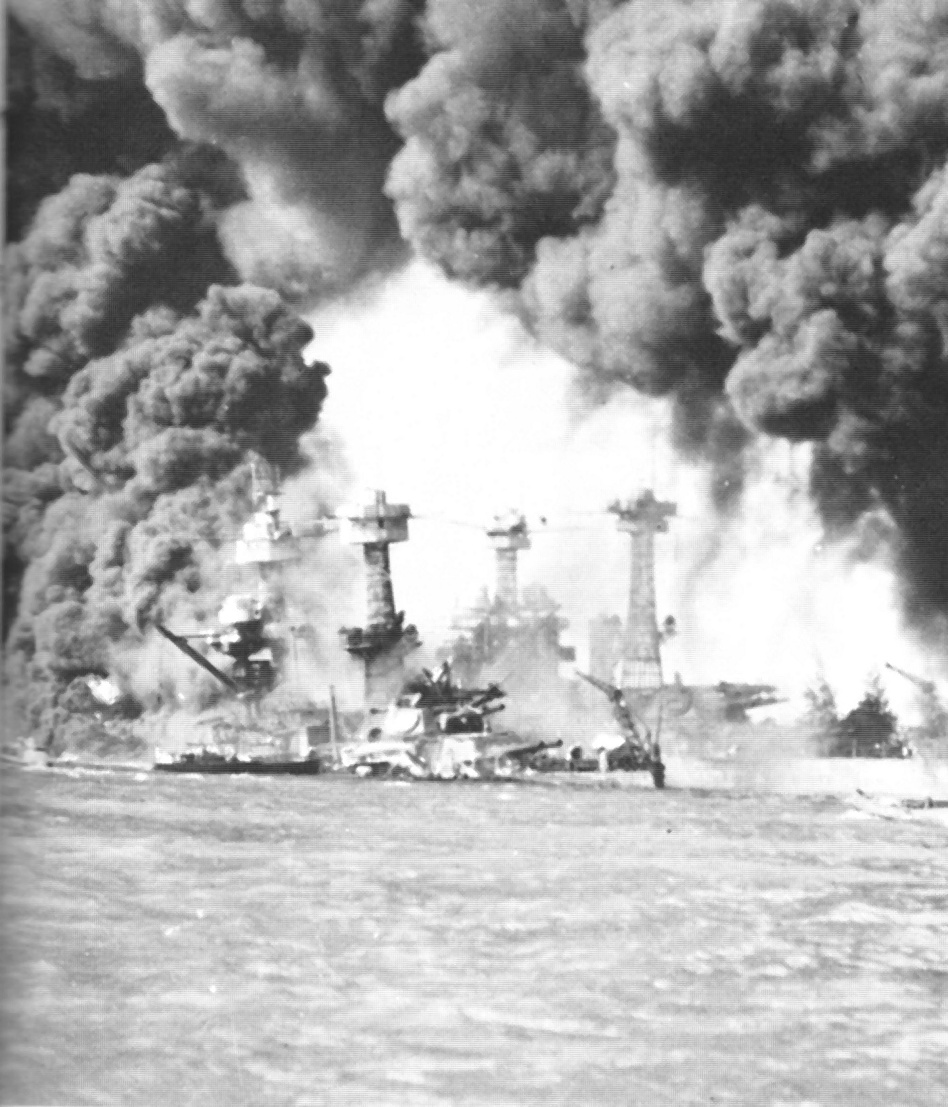 Battleships in Pearl Harbor ablaze after being hit by bombs dropped from Japanese planes on Dec. 7, 1941.