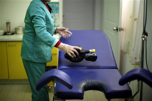 In this photo taken Monday, Dec. 13, 2010, anesthesiologist Liu Jianmin prepares for an abortion at a clinic run by Marie Stopes International in Xi'an in central China's Shaanxi province. While comprehensive data are hard to come by, official figures show abortions are increasing, and Chinese media and experts say many if not most of the abortion-seekers are young, single women. (AP Photo/Ng Han Guan) (AP)