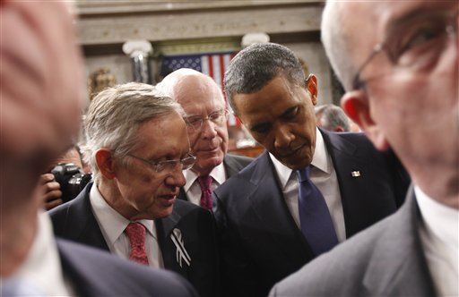 President Barack Obama talks with Senate Majority Leader Harry Reid of Nev., left, and Sen. Patrick Leahy, D-Vt., on Capitol Hill in Washington, Tuesday, Jan. 25, 2011, after delivering his State of the Union address.  (AP Photo/Pablo Martinez Monsivais, Pool) (AP)