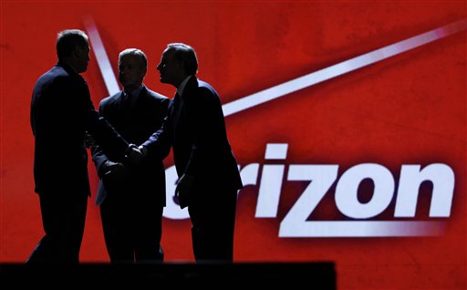 FILE - In this file photo taken Jan. 6, 2011,Consumer Electronics Association president and Chief Executive Officer Gary Shapiro, left, greets Verizon Communications Inc., chairman and Chief Executive Officer Ivan Seidenberg, right, and president and Chief Operating Officer Lowell McAdam during the Consumer Electronics Show, in Las Vegas. As the tech industry awaits a likely Verizon iPhone announcement on Tuesday, Jan. 11, 2011,shares of Apple Inc. hit a record high during Monday trading.  (AP Photo/Julie Jacobson, file) (AP)