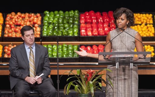Wal-Mart President and CEO Bill Simon looks on as First lady Michelle Obama takes part in Wal-Mart's announcement of a comprehensive effort to provide healthier and more affordable food choices to their customers, Thursday, Jan. 20, 2011, in Washington. (AP Photo/Cliff Owen) (AP)