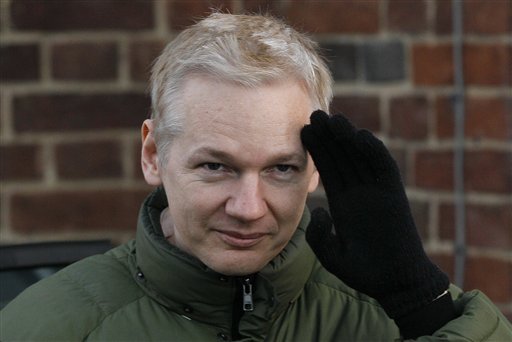 Julian Assange head of WikiLeaks gestures as he gets back into a car at Beccles Police Station in Suffolk, England, Friday, Dec. 17, 2010 after complying with bail conditions. Assange said he feared that the United States is getting ready to indict him, saying Friday that he believed that a grand jury was meeting to consider charges against him. He has repeatedly voiced concerns that American authorities were getting ready to press charges over WikiLeaks' release of some 250,000 secret State Department cables, which have angered and embarrassed officials in Washington. (AP Photo/Kirsty Wigglesworth) (AP)