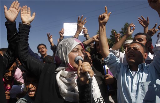 Yemeni students chant slogans calling on their president Ali Abdullah Saleh to leave the government and follow Tunisian ousted President Zine El Abidine Ben Ali into exile during a protest in Sanaa, Yemen, Saturday, Jan. 22, 2011.  (AP Photo/Hani Mohammed) (AP)
