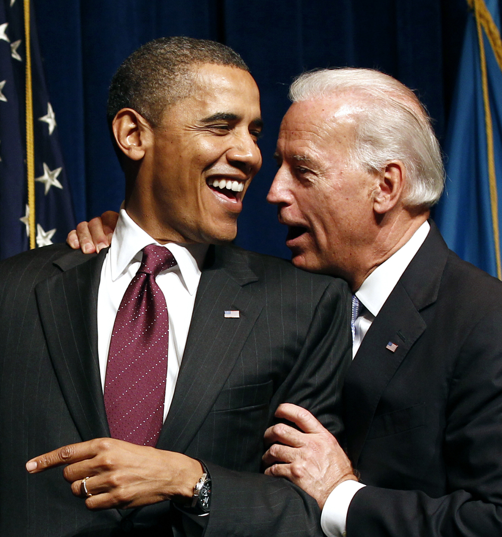 U.S. President Barack Obama laughs with Vice President Joe Biden at an event for candidate Chris Coons, the Democrat running for a Senate seat against Christine O'Donnell in Wilmington, Delaware October 15, 2010. REUTERS/Kevin Lamarque (UNITED STATES - Tags: POLITICS ELECTIONS) (Â© Kevin Lamarque / Reuters)