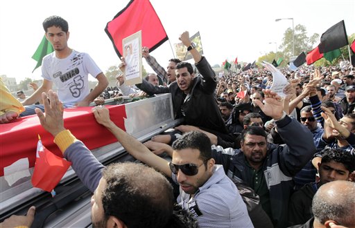 Friends and relatives chant anti-government slogans during the funeral of Mahmoud Maki Abu Taki, 22, who died during clashes between Bahraini anti-government protesters and riot police on Thursday, in Sitra village, Bahrain, Friday, Feb. 18, 2011. (AP Photo/Hassan Ammar) (AP)