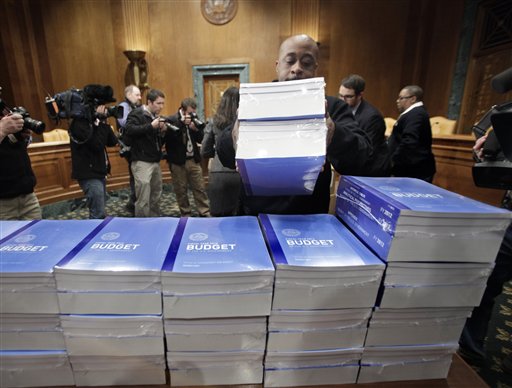 Copies of President Obama's 2012 budget are delivered to the Senate Budget Committee, Monday, Feb. 14, 2011, on Capitol Hill in Washington.  (AP Photo/J. Scott Applewhite) (AP)