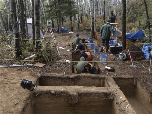 This undated handout photo provided by the journal Science shows a trench connecting both areas of the site in Alaska. Some 11,500 years ago one of America's earliest families laid the remains of a three-year-old child to rest in their home in what is now Alaska. Today archaeologists are learning about the life and times of the early settlers who crossed from Asia to the New World, researchers thank to that burial. (AP Photo/Ben A. Potter, Science) (AP)