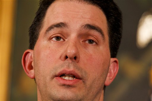 Wisconsin Gov. Scott Walker talks to the media at the state Capitol in Madison, Wis., Monday, Feb. 21, 2011. Opponents to the governor's bill to eliminate collective bargaining rights for many state workers are in the 7th day of protests at the Capitol. (AP Photo/Andy Manis) (AP)
