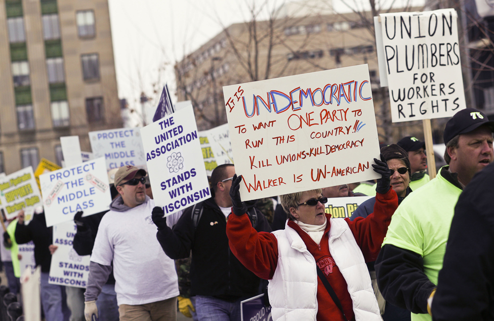 Protesters march around the Capitol Square in Madison, Wis., Friday, Feb. 25, 2011, over the governor's proposed budget. Protests to the governor's bill to eliminate collective bargaining rights for many state workers are in their 11th day. (AP Photo/Andy Manis) (Andy Manis)