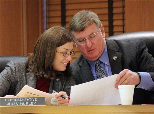 Rep. Julia Hurley of Lenoir City speaks with fellow Republican Rep. Tony Shipley of Kingsport at a committee hearing in Nashville on Tuesday, Feb. 8, 2011. Hurley, in the latest edition of Hooters Magazine, attributes her business and political success to her time working at the restaurant chain known for its waitresses' revealing outfits. (AP Photo/Erik Schelzig) (AP)