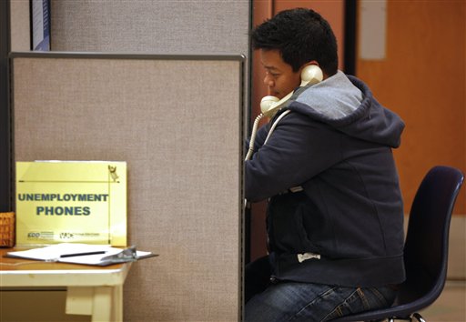 In this photo taken Feb. 3, 2011, unemployed financial worker Jonathan Velazquez, phones in to get State of California's Employment Development Department,  EDD unemployment benefits at the Verdugo Job Center in Glendale, Calif. Finding a job remains a struggle 20 months after the recession technically ended. (AP Photo/Damian Dovarganes) (AP)
