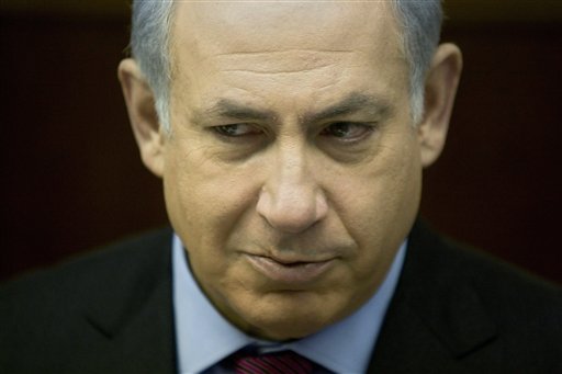 Israeli Prime Minister Benjamin Netanyahu attends the weekly cabinet meeting in his Jerusalem office, Sunday, Jan. 16, 2011. Israeli authorities said Sunday they are moving ahead with a new proposal to build 1,400 apartments in a contested part of Jerusalem, enraging Palestinians who denounced the plan as another settler land grab. (AP Photo/Sebastian Scheiner, Pool) (AP)