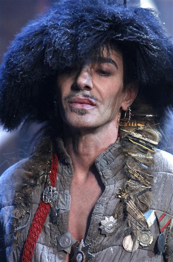 FILE - In this Jan. 21, 2011 file photo, British fashion designer John Galliano appears at the end of his men's fall-winter 2011/2012 fashion collection presented in Paris. Officials say Dior designer John Galliano was briefly detained after a spat in a Paris restaurant. An official with the Paris prosecutor's office says a couple in the restaurant accused Galliano of making anti-Semitic insults. A police official said Friday, Feb. 25, 2011 that Galliano also exchanged slaps with the couple. (AP Photo/Jacques Brinon, File) (AP)