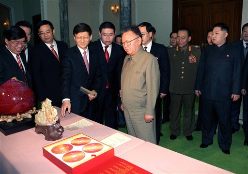 In this photo released by Korean Central News Agency via Korea News Service in Tokyo Tuesday, Feb. 15, 2011, North Korean leader Kim Jong Il, center right, looks at the gifts brought by visiting Chinese Minister of Public Security Meng Jianzhu, fourth left, in Pyongyang, North Korea, on Monday, Feb. 14, 2011. At right is Kim's son Kim Jong Un. (AP Photo/Korean Central News Agency via Korea News Service) JAPAN OUT (AP)