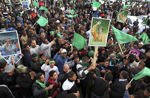 Pro-Gadhafi supporters gather in Green Square after traditional Friday prayers in Tripoli, Libya, Friday, Feb. 18, 2011. Protesters battled with security forces for control of neighborhoods Friday in eastern Libya where dozens have reportedly been killed in two days of clashes, as a leadership congress controlled by Moammar Gadhafi pledged a change in government adminstrators, trying to ease demonstrations demanding the longtime leader's ouster. (AP Photo/Abdel Meguid al-Fergany) (AP)