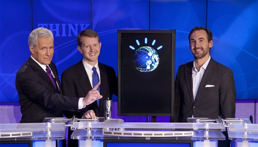 In this undated publicity image released by Jeopardy Productions, Inc., host Alex Trebek, left, poses with contestants Ken Jennings, center, and Brad Rutter and a computer named Watson in Yorktown Heights, N.Y. On Monday, Feb. 14, 2011, "Jeopardy!" will begin airing two matches spread over three days between Jennings, Rutter and Watson, who was developed by IBM scientists. (AP Photo/Jeopardy Productions, Inc.) NO SALES (AP)