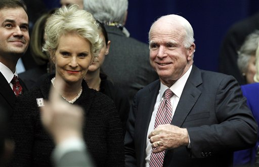 Sen. John McCain, R-Ariz., and wife Cindy arrive at a memorial service for the victims of Saturday's shootings at McKale Center on the University of Arizona campus Wednesday, Jan. 12, 2011, in Tucson, Ariz. (AP Photo/Chris Carlson) (AP)