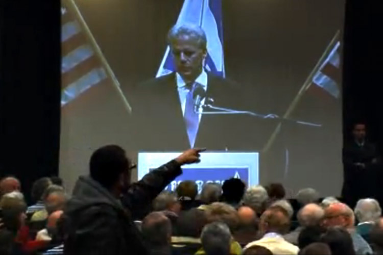 A protester interrupts Israeli Ambassador Michael Oren at University of California at Irvine in February 2010.