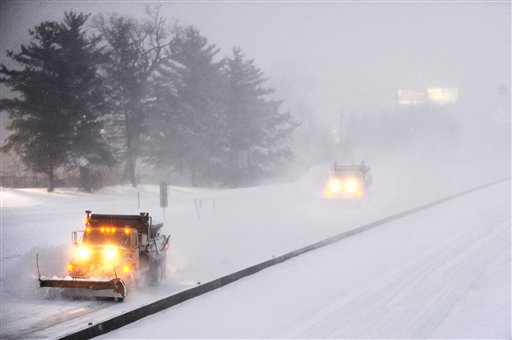 Snow plows drive westbound along Interstate 70 Tuesday, Feb. 1, 2011 in Columbia, Mo. Earlier in the day, the Missouri Department of Transportation closed Interstate 70 between Kansas City and St. Louis because of the storm, which is expected to dump between 18 and 24 inches of snow across mid-Missouri. (AP Photo/The Columbia Daily Tribune, Joshua A. Bickel) (AP)