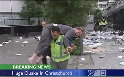 In this image made from video run by New Zealand's TV3, an injured person is carried on a street in Christchurch, New Zealand Tuesday, Feb. 22, 2011 after a 6.3-magnitude earthquake rocked the city. (AP Photo/TV3 via Associated Press Television News) NEW ZEALAND OUT, TV OUT (AP)