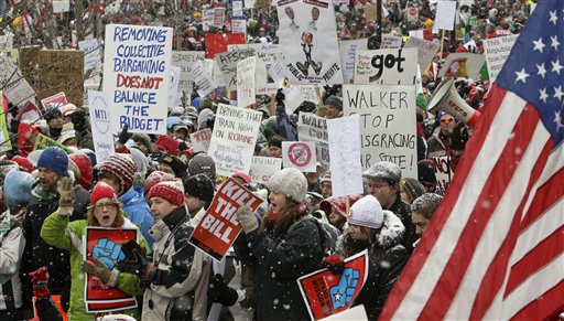 Opponents to the governor's bill to eliminate collective bargaining rights for many state workers protest outside of the state Capitol in Madison, Wis., Saturday, Feb. 26, 2011. Union supporters are on the 12th day of protests at the Capitol. (AP Photo/Andy Manis) (AP)