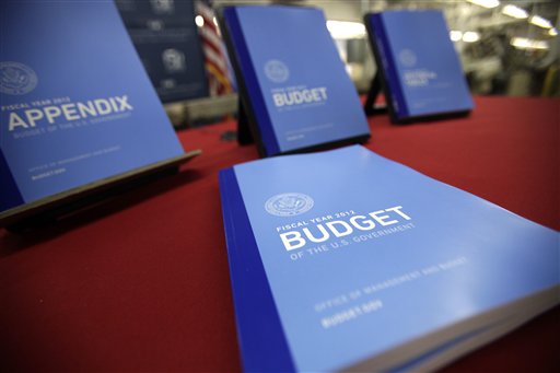 In this photo taken Feb. 10, 2011, the 2012 budget is on display at the U.S. Government Printing Office at Washington. President Barack Obama Obama will send his 2012 budget proposal to Congress on Monday, Feb. 14.  According to an Office of Management and Budget summary obtained by The Associated Press, the administration will propose more than $1 trillion in deficit reduction over the next decade with two-thirds of that amount coming from spending cuts.  (AP Photo/Jacquelyn Martin) (AP)