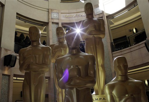 Oscar statues stand in front of the Kodak Theatre as preparations for the 83rd Academy Awards continue in Los Angeles, Saturday, Feb. 26, 2011. (AP Photo/Jae C. Hong) (AP)