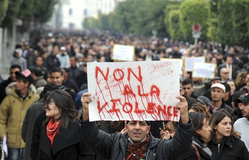 Protestors supporting the government and opposed to strikes demonstrate in Tunis, Tuesday Jan. 25, 2011. Tunisia's so-called "Jasmine Revolution" has sparked scattered protests and civil disobedience in the Middle East and North Africa, and much of the world is watching to see how the birth pangs of Tunisian democracy play out. Poster reads: No to the violence. (AP Photo/Hassene Dridi) (AP)