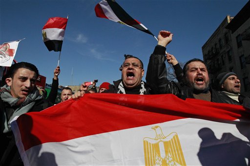 People celebrate after Egypt's President Hosni Mubarak resigned from office Friday, Feb. 11, 2011 in the Queens borough of New York. Mubarak resigned as president after 29 years in power. (AP Photo/Frank Franklin II) (AP)