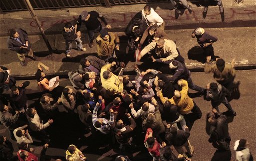 Egyptian President Hosni Mubarak's supporters scuffle with anti-government protesters near the Tahrir (Liberation) Square, early Wednesday, Feb. 2, 2011. Mubarak announced  he will not run for a new term in September elections but rejected protesters' demands he step down immediately and leave the country, vowing to die on Egypt's soil, after a dramatic day in which a quarter-million Egyptians staged their biggest protest yet calling on him to go. (AP Photo/Lefteris Pitarakis) (AP)