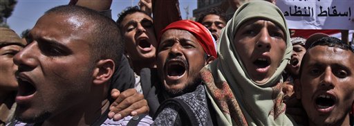 Anti-government protestors chant slogans during a demonstration demanding the resignation of Yemeni President Ali Abdullah Saleh, in Sanaa, Yemen, Thursday, Feb. 24, 2011. Yemen's president said Wednesday he had ordered his security services to protect protesters, stop all clashes and prevent direct confrontation between government supporters and opponents. (AP Photo/Muhammed Muheisen) (AP)