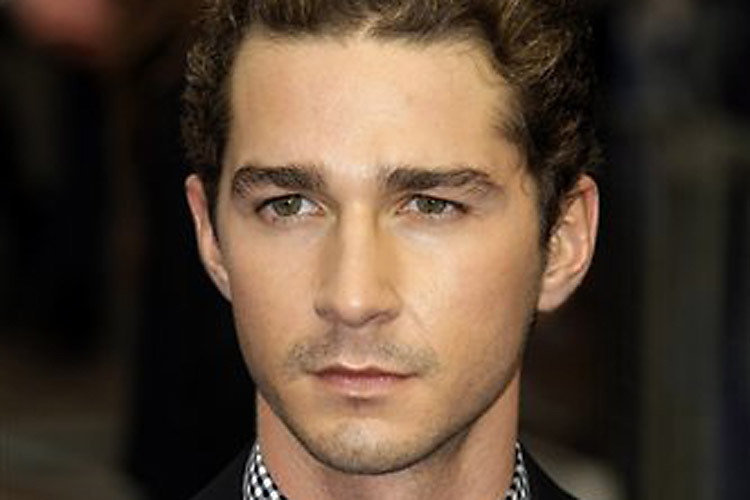 Actor Shia LaBeouf poses for photographers as he arrives for the UK premiere of the film 'Transformers: Revenge of the Fallen' at a cinema in London, Monday June 15, 2009.  (AP Photo/Matt Dunham) (Matt Dunham)