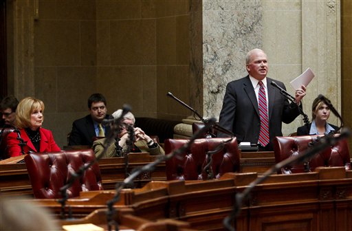 Wisconsin Majority Leader Scott Fitzgerald, standing right, R-Juneau, talks about the rules in the senate handbook during debate on floor at the state Capitol in Madison, Wis., Wednesday, Feb. 23, 2011. Fourteen democratic Senators are in undisclosed locations effectively stalling the governor's budget proposal. Opponents to the governor's bill to eliminate collective bargaining rights for many state workers on their ninth day of protests at the Capitol.  (AP Photo/Andy Manis) (AP)