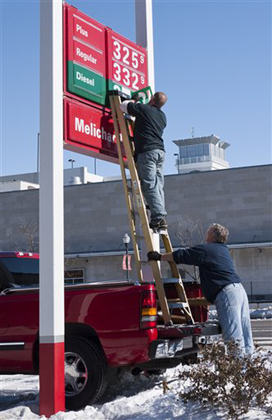 The price of fuel is adjusted at a gas station in Lincoln, Neb., Thursday, Feb. 3, 2011. Gasoline prices increased less than a penny overnight to a national average of $3.116 per gallon, according to AAA, Wright Express and Oil Price Information Service. A gallon of regular is 4.3 cents higher than a month ago and 46 cents more expensive than a year ago.(AP Photo/Nati Harnik) (Nati Harnik)