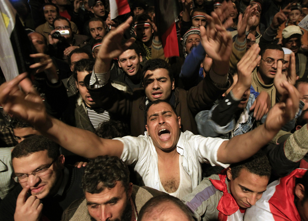 Opposition supporters shout in their stronghold of Tahrir Square, in Cairo February 10, 2011. President Hosni Mubarak provoked rage on Egypt's streets on Thursday when he said he would hand powers to his deputy but disappointed protesters who had been expecting him to step down altogether after two weeks of unrest. "Leave! Leave!" chanted thousands who had gathered in Cairo's Tahrir Square in anticipation that a televised speech would be the moment their demands for an end to Mubarak's 30 years of authoritarian, one-man rule were met.  REUTERS/Goran Tomasevic (EGYPT - Tags: POLITICS CIVIL UNREST) (Â© Goran Tomasevic / Reuters)