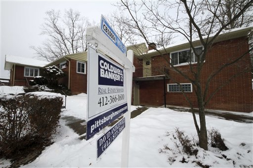 In this Feb. 9, 2011 photo, a house for sale is shown in Mt. Lebanon, Pa. More people bought previously occupied homes in January, but sales surged on a rising number of foreclosures and all-cash deals. (AP Photo/Gene J. Puskar) (AP)