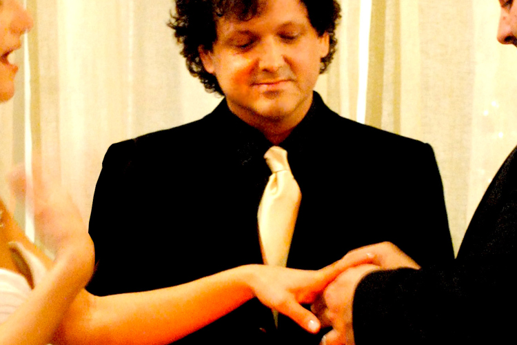 The author, center, performing a wedding ceremony.
